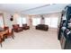 Open living room with comfortable seating, custom built-ins, and plenty of natural light at 3045 Camp Branch Rd, Buford, GA 30519