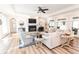 Spacious living room with a cozy fireplace, hardwood floors, and plenty of natural light at 3045 Camp Branch Rd, Buford, GA 30519