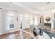 Bright living room featuring hardwood floors, large windows, and stylish decor at 3045 Camp Branch Rd, Buford, GA 30519
