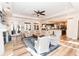 Open-concept living room filled with natural light and comfortable seating areas at 3045 Camp Branch Rd, Buford, GA 30519