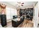 Spacious office area includes hardwood floors, shelving and large windows at 3045 Camp Branch Rd, Buford, GA 30519