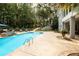 A stunning swimming pool area with a spa, inviting lounge chairs, and lush greenery, perfect for relaxation and entertainment at 3045 Camp Branch Rd, Buford, GA 30519