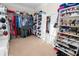 Walk-in closet featuring custom shelving and storage solutions for an organized space at 3045 Camp Branch Rd, Buford, GA 30519