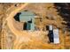 Overhead view of a property with sprawling land, outbuildings, garden and home with a green metal roof at 511 Monroe Cole Rd, Dallas, GA 30157