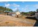 Expansive backyard with a greenhouse and large open space at 511 Monroe Cole Rd, Dallas, GA 30157
