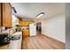 Spacious kitchen and dining area featuring hardwood floors and a large window with natural light at 511 Monroe Cole Rd, Dallas, GA 30157