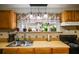 Kitchen area with a large window that streams natural light over the sink at 511 Monroe Cole Rd, Dallas, GA 30157