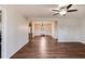 Open-concept living room with wood flooring and ceiling fan at 511 Monroe Cole Rd, Dallas, GA 30157
