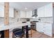 Modern kitchen with white cabinets, marble countertops, and stainless steel appliances at 413 Herrington Ne Rd, Atlanta, GA 30342