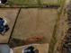Aerial view of a land lot ready for building, perfectly situated among mature trees in an established neighborhood at 5170 Howard Road A, Cumming, GA 30040