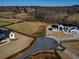 Stunning aerial view of a modern home with expansive yard and beautiful landscaping at 5170 Howard Road A, Cumming, GA 30040