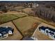 Expansive land lot ready for new construction, showcasing a perfect blend of open space and wooded privacy at 5170 Howard Road A, Cumming, GA 30040