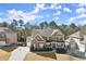 Aerial view of a brick home with a well-maintained lawn and a basketball hoop at 170 Wheaten Dr, Woodstock, GA 30188
