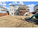 Rear view of home, showing walkout and wooden patio at 170 Wheaten Dr, Woodstock, GA 30188
