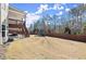 Expansive backyard featuring a playset and ample space for recreation and relaxation at 170 Wheaten Dr, Woodstock, GA 30188