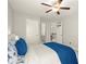 Bedroom features a ceiling fan, neutral paint, and ensuite bathroom at 170 Wheaten Dr, Woodstock, GA 30188