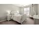 Bedroom featuring a hanging chair, chandelier, and large window with light at 170 Wheaten Dr, Woodstock, GA 30188
