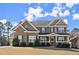 Charming brick home with a welcoming front porch and manicured lawn at 170 Wheaten Dr, Woodstock, GA 30188