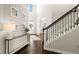 Bright foyer with a staircase and hardwood floors, creating a welcoming atmosphere at 170 Wheaten Dr, Woodstock, GA 30188