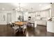 Open kitchen featuring a large island with seating, stainless steel appliances, and dark hardwood flooring at 170 Wheaten Dr, Woodstock, GA 30188