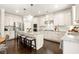 Spacious kitchen featuring a center island with seating, stainless steel appliances, and granite countertops at 170 Wheaten Dr, Woodstock, GA 30188