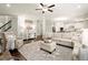 Spacious living room with hardwood floors and elegant decor with lots of natural light at 170 Wheaten Dr, Woodstock, GA 30188