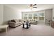 Spacious living room with large windows, neutral paint, and light carpet at 170 Wheaten Dr, Woodstock, GA 30188