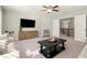 Upstairs living room with black coffee table, large TV, and open doorway at 170 Wheaten Dr, Woodstock, GA 30188