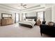 Spacious main bedroom featuring a trey ceiling, a sitting area, and carpeted floors at 170 Wheaten Dr, Woodstock, GA 30188