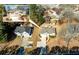 An aerial view of two homes with tree coverage and pleasant landscaping in a well-maintained neighborhood at 1800 Rockdale Cir, Snellville, GA 30078