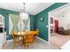 Charming breakfast nook with wooden table, four chairs and plenty of natural light at 1800 Rockdale Cir, Snellville, GA 30078
