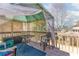 The house has a pleasant deck featuring two chairs, a table, and a shaded cover from sun and weather at 1800 Rockdale Cir, Snellville, GA 30078