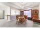 Elegant dining room featuring a chandelier, striped wallpaper, and ample seating at 1800 Rockdale Cir, Snellville, GA 30078