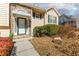 Inviting front entrance with stone accents, green trim, and a well-maintained yard at 1800 Rockdale Cir, Snellville, GA 30078