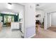 Bright kitchen with white cabinets, stainless steel appliances, and a casual dining area at 1800 Rockdale Cir, Snellville, GA 30078