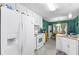Well-equipped kitchen with white appliances, ample counter space, and an adjacent dining area at 1800 Rockdale Cir, Snellville, GA 30078