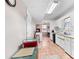 Small kitchenette space with access to a small freezer, white cabinets, and sink at 1800 Rockdale Cir, Snellville, GA 30078