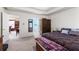 Comfortable bedroom featuring a king-size bed and adjacent bathroom and dining room at 1800 Rockdale Cir, Snellville, GA 30078