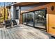 Relaxing outdoor deck with patio furniture and sliding glass doors leading to the interior at 2751 Margaret Mitchell Nw Dr, Atlanta, GA 30327
