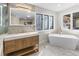 Modern bathroom featuring a freestanding tub, an oversized vanity, and bright natural light at 2751 Margaret Mitchell Nw Dr, Atlanta, GA 30327