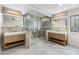 Elegant bathroom featuring dual vanities, a luxurious walk-in shower, and stylish gold fixtures at 2751 Margaret Mitchell Nw Dr, Atlanta, GA 30327