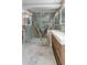 Luxurious bathroom with walk-in shower, double vanity, and striking marble accent wall at 2751 Margaret Mitchell Nw Dr, Atlanta, GA 30327