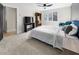 Bedroom with carpeted floors, ceiling fan, a large window and comfortably decorated in neutral colors at 2751 Margaret Mitchell Nw Dr, Atlanta, GA 30327