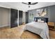 Stylish bedroom with a hardwood floors, paneled accent wall, and ample natural light at 2751 Margaret Mitchell Nw Dr, Atlanta, GA 30327