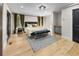 Cozy main bedroom featuring hardwood floors and soft, natural lighting at 2751 Margaret Mitchell Nw Dr, Atlanta, GA 30327
