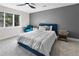 Bedroom featuring an accent wall and filled with natural light from a large window at 2751 Margaret Mitchell Nw Dr, Atlanta, GA 30327