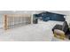 Large bonus room featuring carpeted floors, entertainment options, and a modern railing at 2751 Margaret Mitchell Nw Dr, Atlanta, GA 30327
