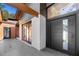 Elegant home entrance featuring a modern black door, tile flooring, and seamless indoor-outdoor transition at 2751 Margaret Mitchell Nw Dr, Atlanta, GA 30327
