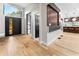 Bright open-concept foyer with modern black door, hardwood floors, and seamless flow to living spaces at 2751 Margaret Mitchell Nw Dr, Atlanta, GA 30327