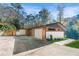 Stylish home with a modern design, featuring a large driveway and attached garage at 2751 Margaret Mitchell Nw Dr, Atlanta, GA 30327